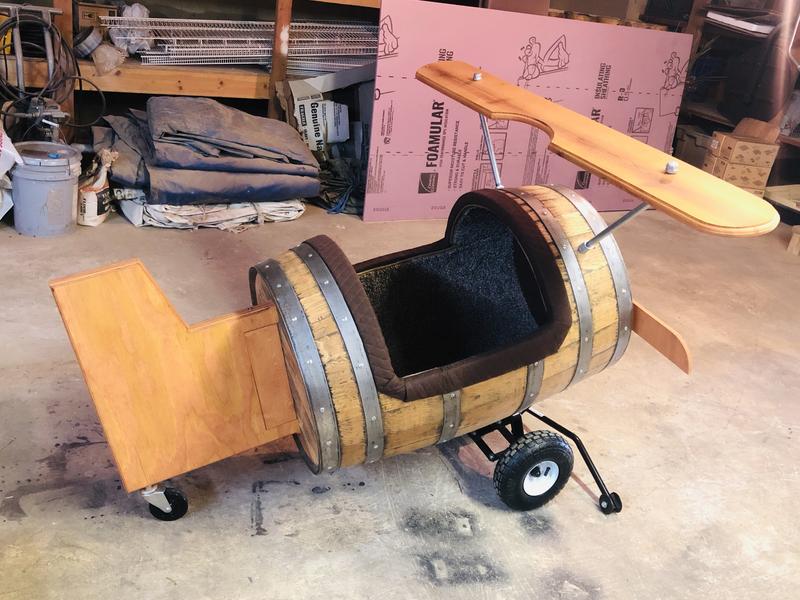 Whiskey Barrel modified into a small wooden plane